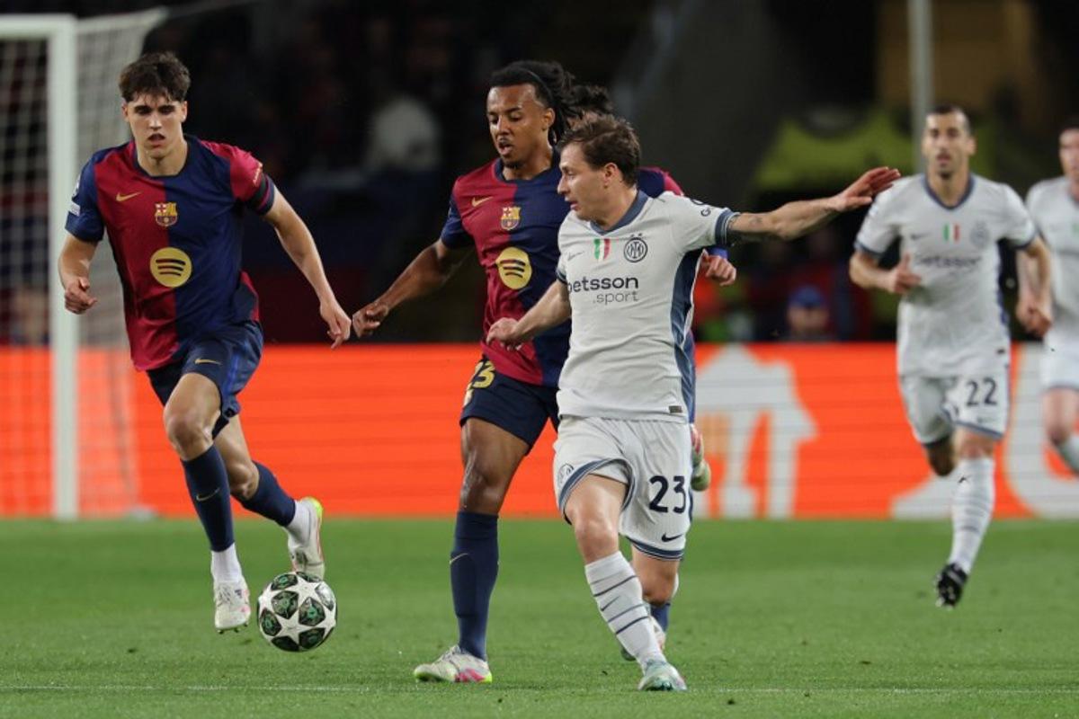 Barcelona's French defender #23 Jules Kounde (2L) and Inter Milan's Italian midfielder #23 Nicolo Barella vie for the ball during the UEFA Champions League semi final first leg football match between FC Barcelona and Inter Milan at the Estadi Olimpic Lluis Companys in Barcelona on April 30, 2025.  LLUIS GENE / AFP