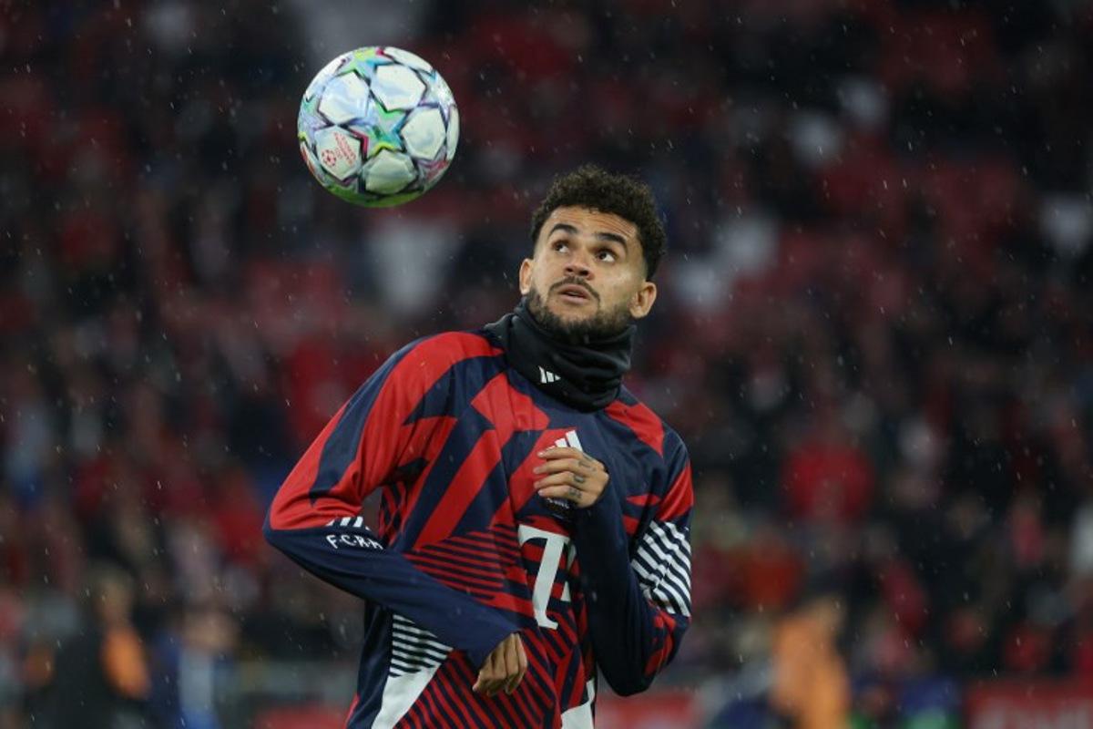 Bayern Munich's Colombian forward #14 Luis Diaz warms up prior to the UEFA Champions League football match between FC Bayern Munich and Arsenal FC in Munich, southern Germany on October 21, 2026. Karl-Josef HILDENBRAND / AFP