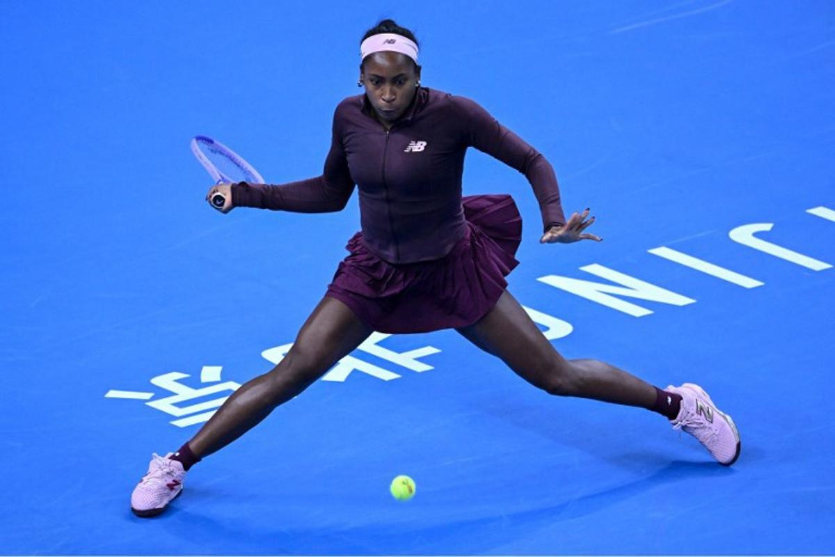 USA's Coco Gauff hits a return to China's Sun Xinran during their women's singles match at the China Open tennis tournament in Beijing on October 5, 2026. ADEK BERRY / AFP