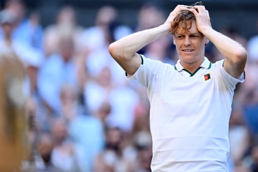 Italy's Jannik Sinner reacts to beating Germany's Alexander Zverev (R) for winning their men's singles final tennis match on the fourteenth day of the 2026 Wimbledon Championships at The All England Lawn Tennis and Croquet Club in Wimbledon, southwest London, on July 12, 2026. Kirill KUDRYAVTSEV / AFP