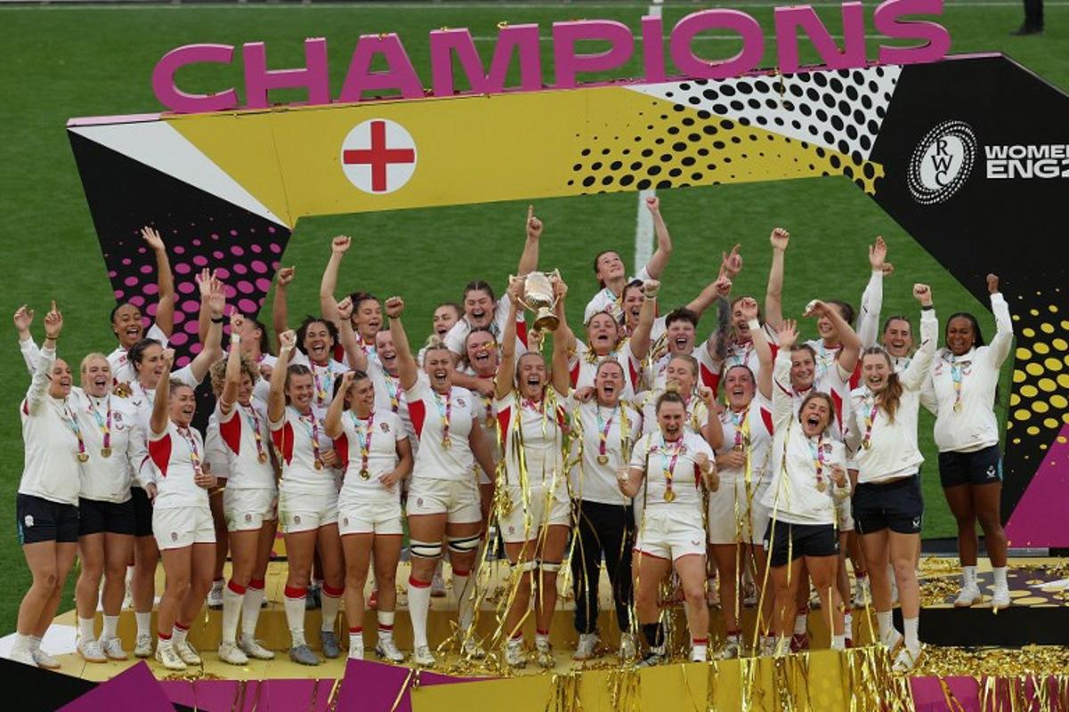 England lift the trophy after winning the Women's Rugby World Cup final between Canada and England at The Allianz Stadium, Twickenham, south-west London on September 27, 2025. England beat Canada 33-13. Adrian Dennis / AFP