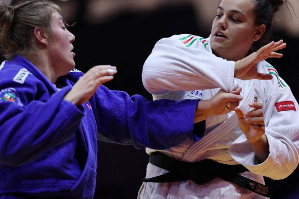 Italy's Asya Tavano (white) competes against Belgium's Gabrielle Bouvier in the women's over 78 kg round of 16 at the World Judo Championships in Baku on October 10, 2026. Anne-Christine POUJOULAT / AFP