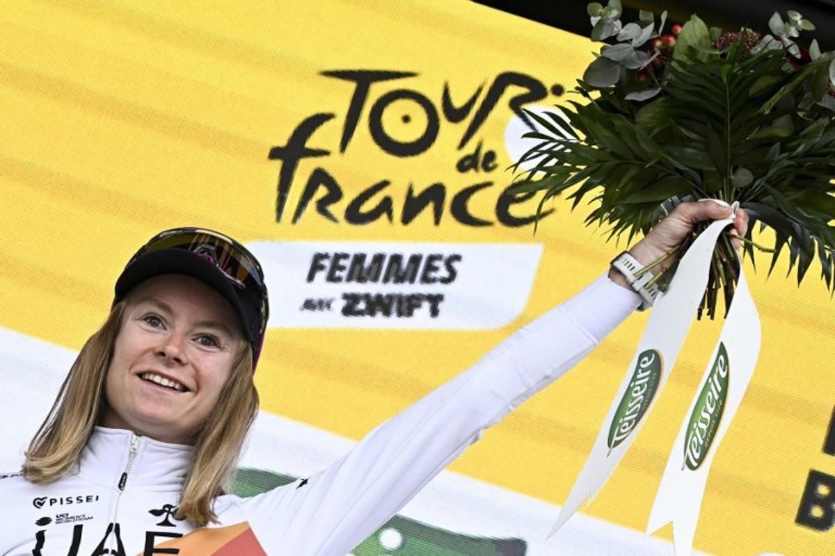 UAE Team ADQ's French rider Maeva Squiban celebrates winning the combativity award on the podium of the 2nd stage (out of 9) of the fourth edition of the Women's Tour de France cycling race, 110,4 km from Brest to Quimper on July 27, 2025. Julien DE ROSA / AFP
