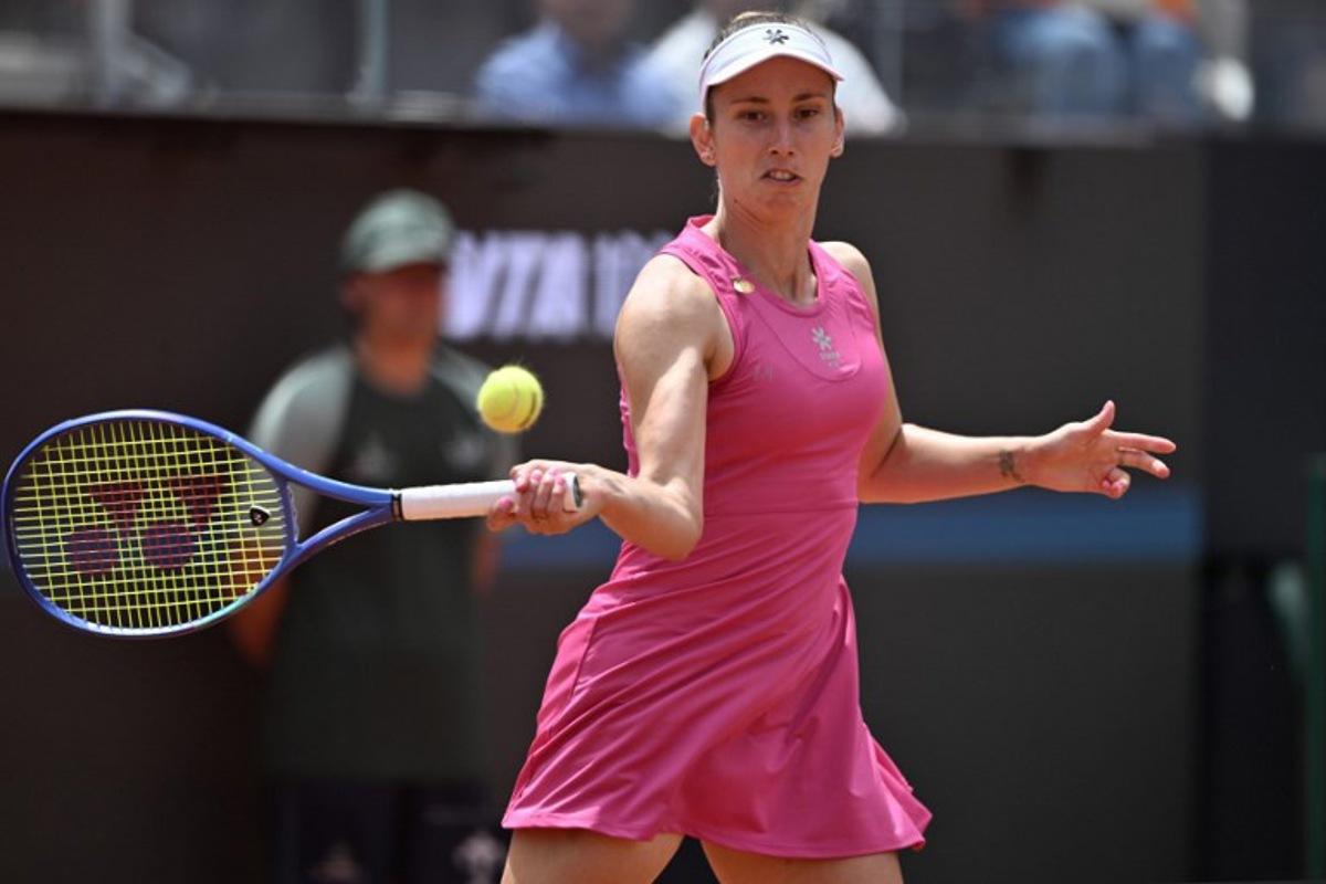 Belgium's Elise Mertens hits a return to Italy's Jasmine Paolini during the WTA Rome Open tennis tournament at Foro Italico in Rome on May 9, 2026. Tiziana FABI / AFP