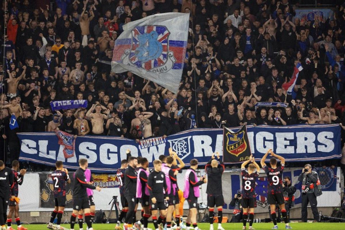 Rangers' players celebrate with supporters at the end of the UEFA Europa League football match between Malmoe FF and Rangers FC in Malmoe, Sweden on September 26, 2024. Rangers won the match 2-0. Andreas HILLERGREN / TT NEWS AGENCY / AFP