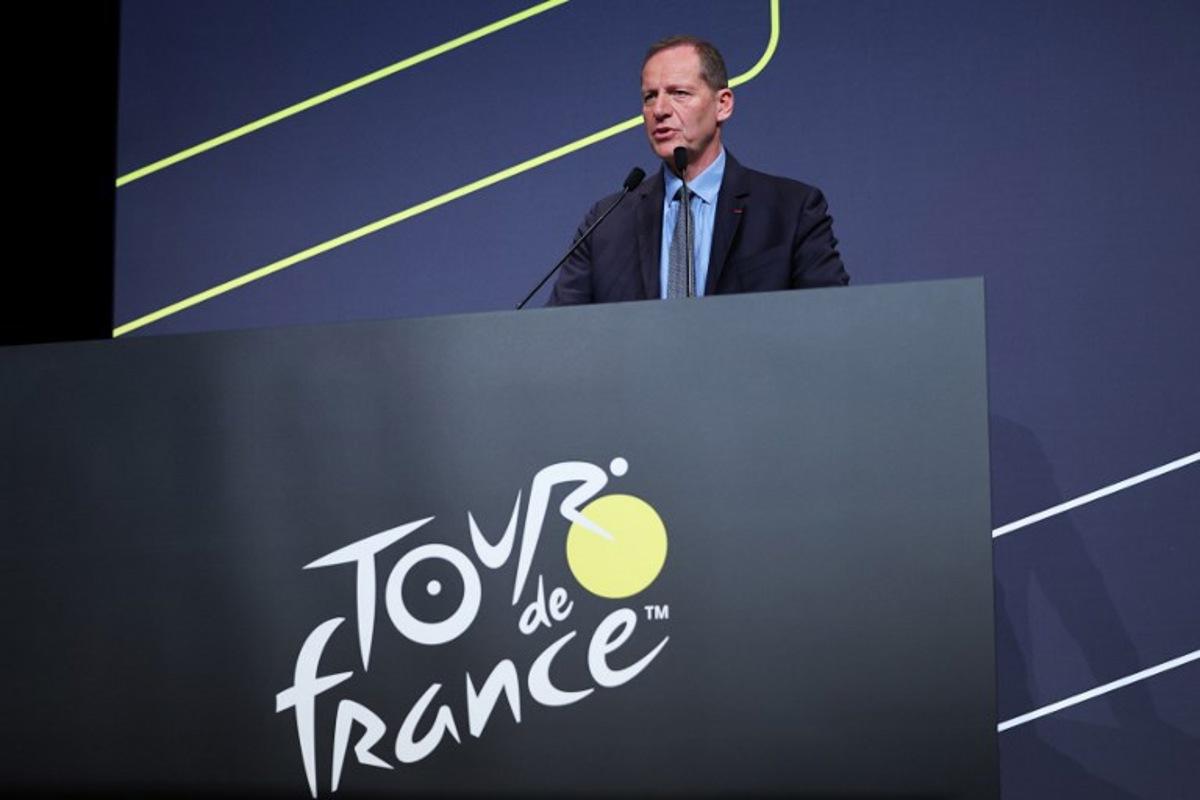Tour de France General Director Christian Prudhomme addresses the audience during the presentation of the official routes of the 2026 edition of the men's and women's Tour de France cycling race in Paris on October 23, 2025. Anne-Christine POUJOULAT / AFP