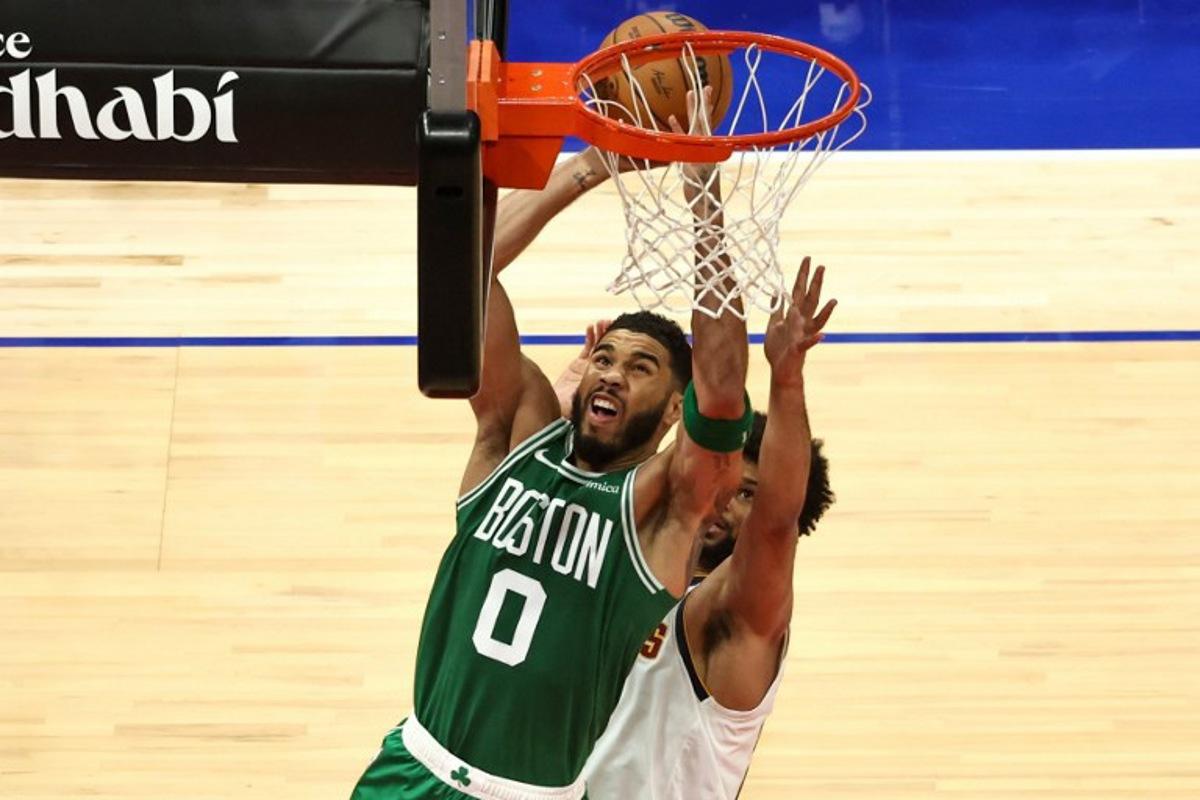 Boston Celtics' forward #0 Jayson Tatum jumps to shoot during the NBA Preseason game between the Boston Celtics and the Denver Nuggets at the Etihad Arena in Abu Dhabi on October 6, 2024. Fadel Senna / AFP