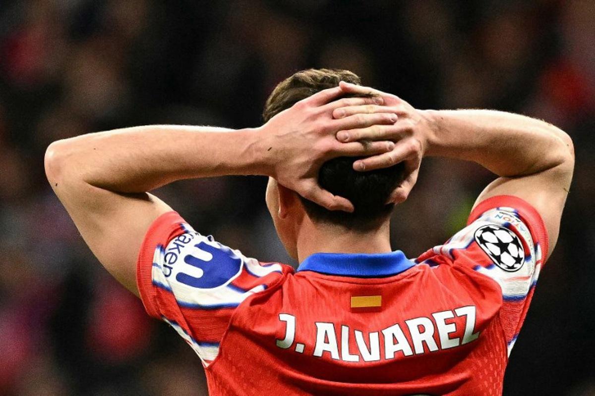 Atletico Madrid's Argentine forward #19 Julian Alvarez reacts during the UEFA Champions League Round of 16 second leg football match between Club Atletico de Madrid and Real Madrid CF at the Metropolitano stadium in Madrid on March 12, 2025. JAVIER SORIANO / AFP