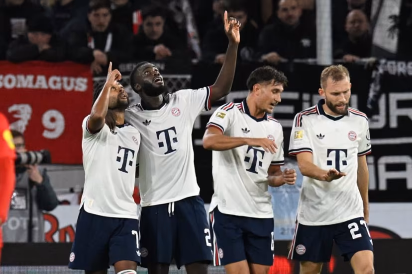 Bayern Munich's German forward #07 Serge Gnabry (L) celebrates with Bayern Munich's French defender #02 Dayot Upamecano (2nd L) after scoring the 0:2 goal during the German first division Bundesliga football match between SC Freiburg and FC Bayern Munich in Freiburg, south-western Germany, on October 25, 2026. THOMAS KIENZLE / AFP