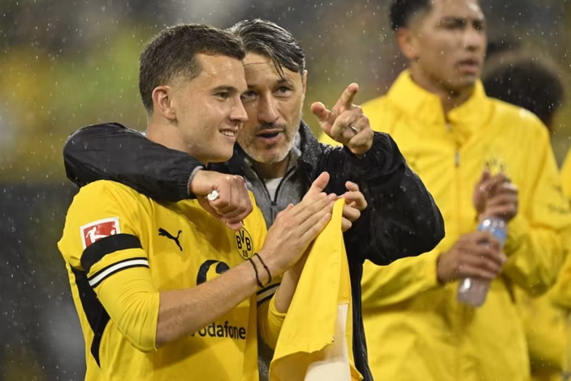 Dortmund's Croatian head coach Niko Kovac celebrates with Dortmund's Greek midfielder #19 Konstantinos Karetsas after the German first division Bundesliga football match between BVB Borussia Dortmund and Hamburg SV in Dortmund, western Germany on August 29, 2026. INA FASSBENDER / AFP
