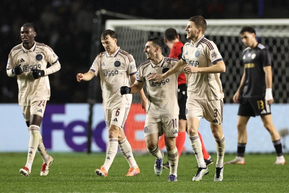 Ajax's Israeli midfielder #10 Oscar Gloukh celebrates after scoring the team's second goal during the UEFA Champions League league phase football match between Qarabag and Ajax at the Tofiq Bahramov Republican Stadium in Baku on December 10, 2025. Giorgi ARJEVANIDZE / AFP