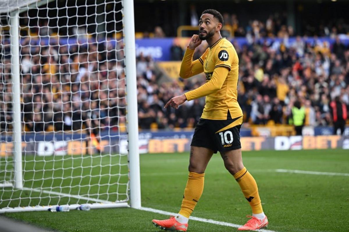 Wolverhampton Wanderers' Brazilian striker #10 Matheus Cunha reacts after scoring their fourth goal during the English Premier League football match between Wolverhampton Wanderers and Tottenham Hotspur at the Molineux stadium in Wolverhampton, central England on April 13, 2025. JUSTIN TALLIS / AFP