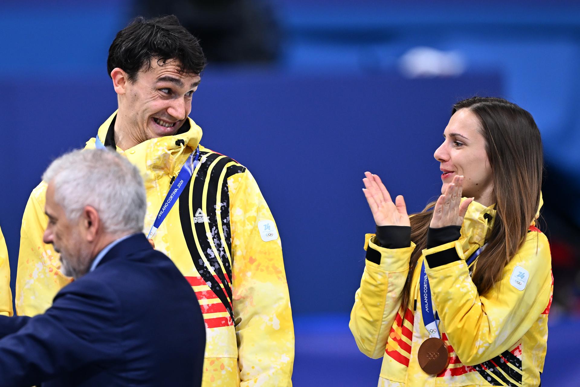 Belgian shorttrack skater Stijn Desmet and Belgian shorttrack skater Hanne Desmet celebrate their bronze medal on the podium of the Mixed Team Relay of the Short Track Speed Skating competition at the Milano Cortina 2026 Olympic Winter Games, on Tuesday 10 February 2026 in Milan, Italy. The XXV Winter Olympics take place from 6 to 22 February 2026 in Italy. BELGA PHOTO JASPER JACOBS