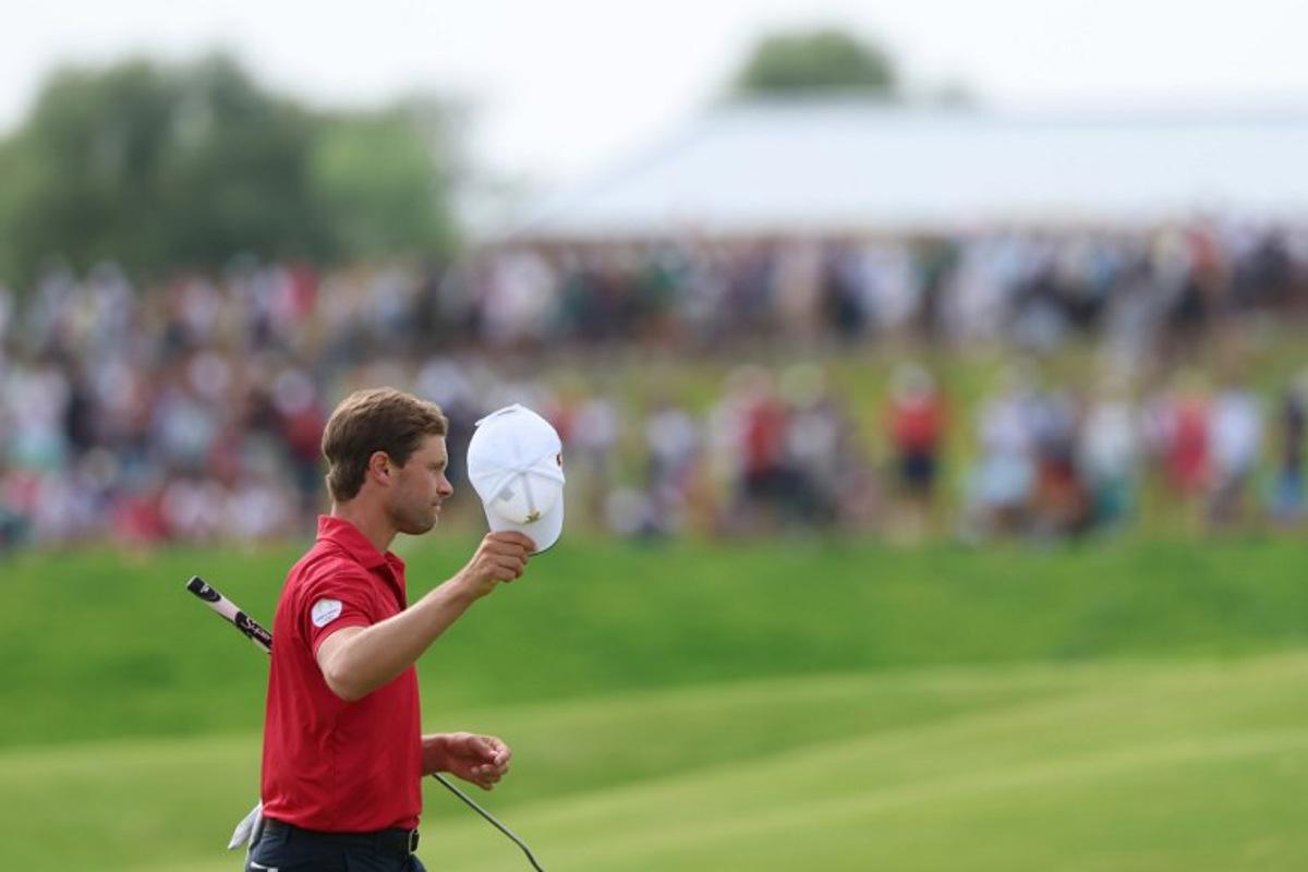 Belgium's Thomas Detry gestures after completing the course in round 4 of the men's golf individual stroke play of the Paris 2024 Olympic Games at Le Golf National in Guyancourt, south-west of Paris on August 4, 2024. Emmanuel DUNAND / AFP