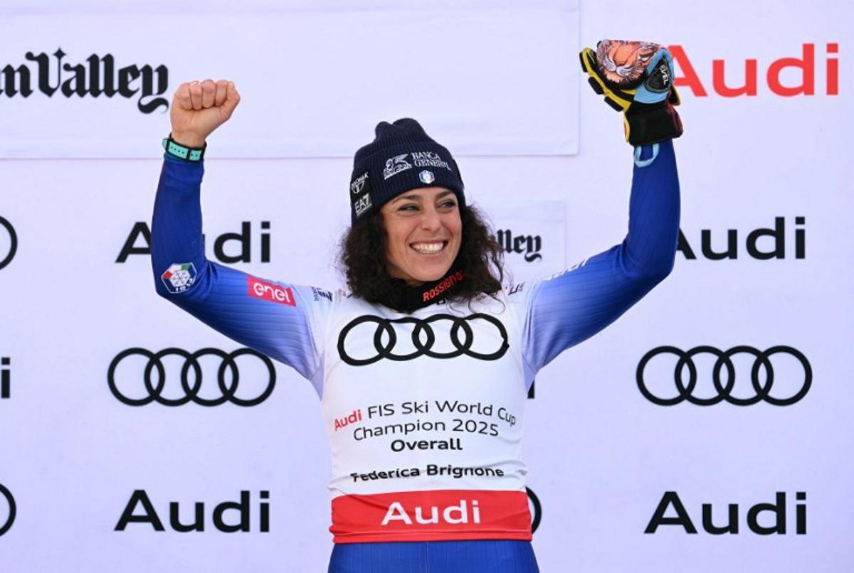 Women's overall winner Federica Brignone celebrates on the podium at the 2025 FIS Alpine World Cup Finals at Sun Valley Resort in Sun Valley, Idaho, on March 27, 2025. Patrick T. Fallon / AFP