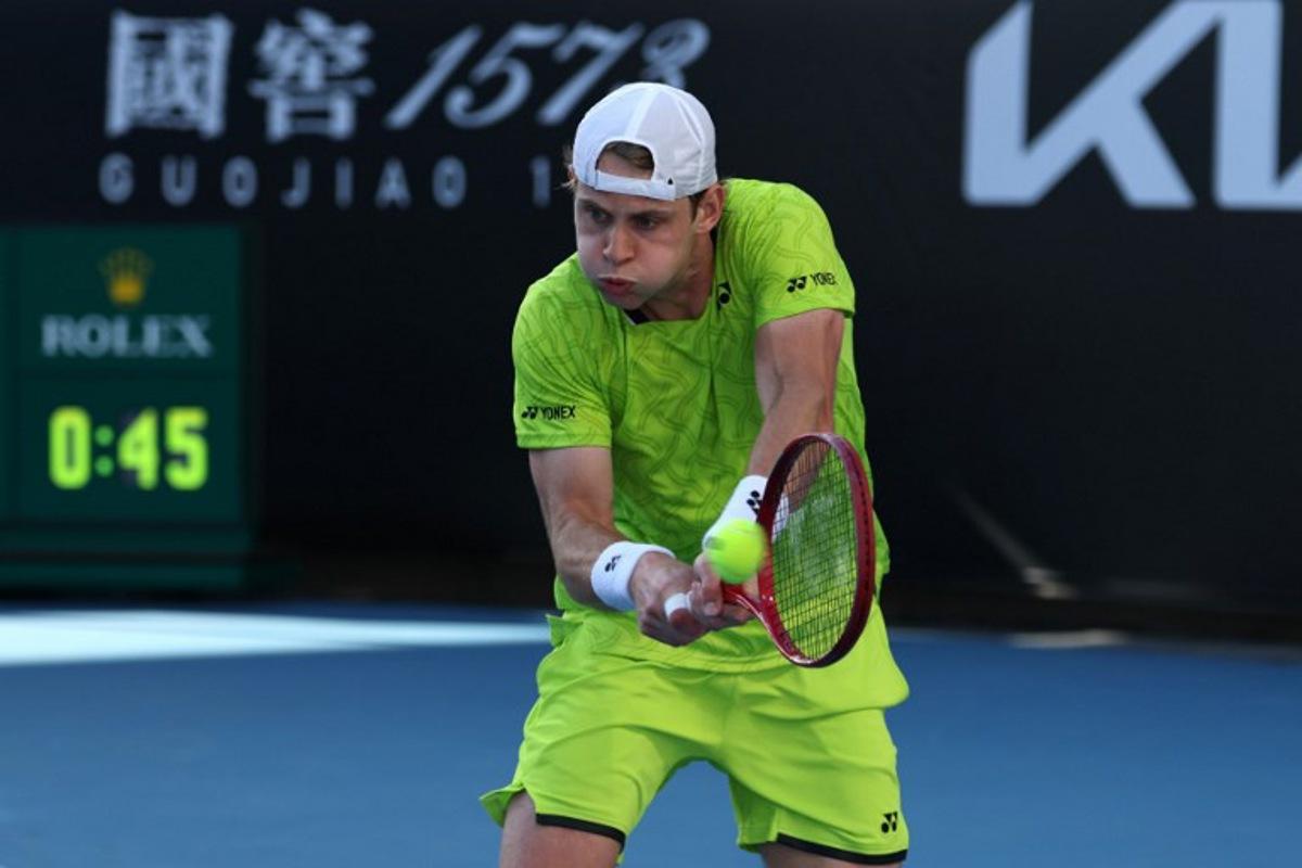 Belgium's Zizou Bergs hits a shot against Poland's Hubert Hurkacz during their men's singles match on day three of the Australian Open tennis tournament in Melbourne on January 20, 2026. IZHAR KHAN / AFP