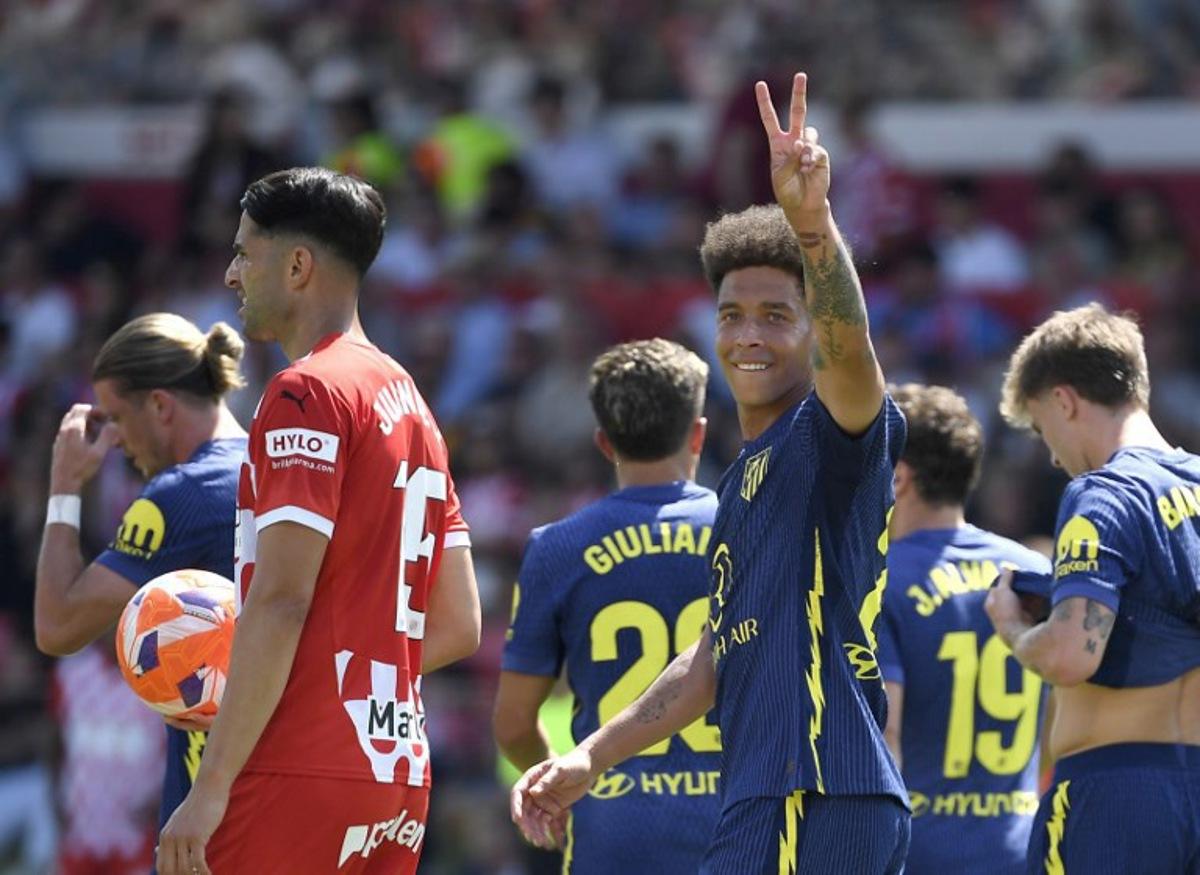 Atletico Madrid's Belgian midfielder #20 Axel Witsel celebrates after Atletico Madrid's second goal during the Spanish league football match between Girona FC and Club Athletic de Madrid at Montilivi Stadium in Girona, on May 25, 2025. Josep LAGO / AFP