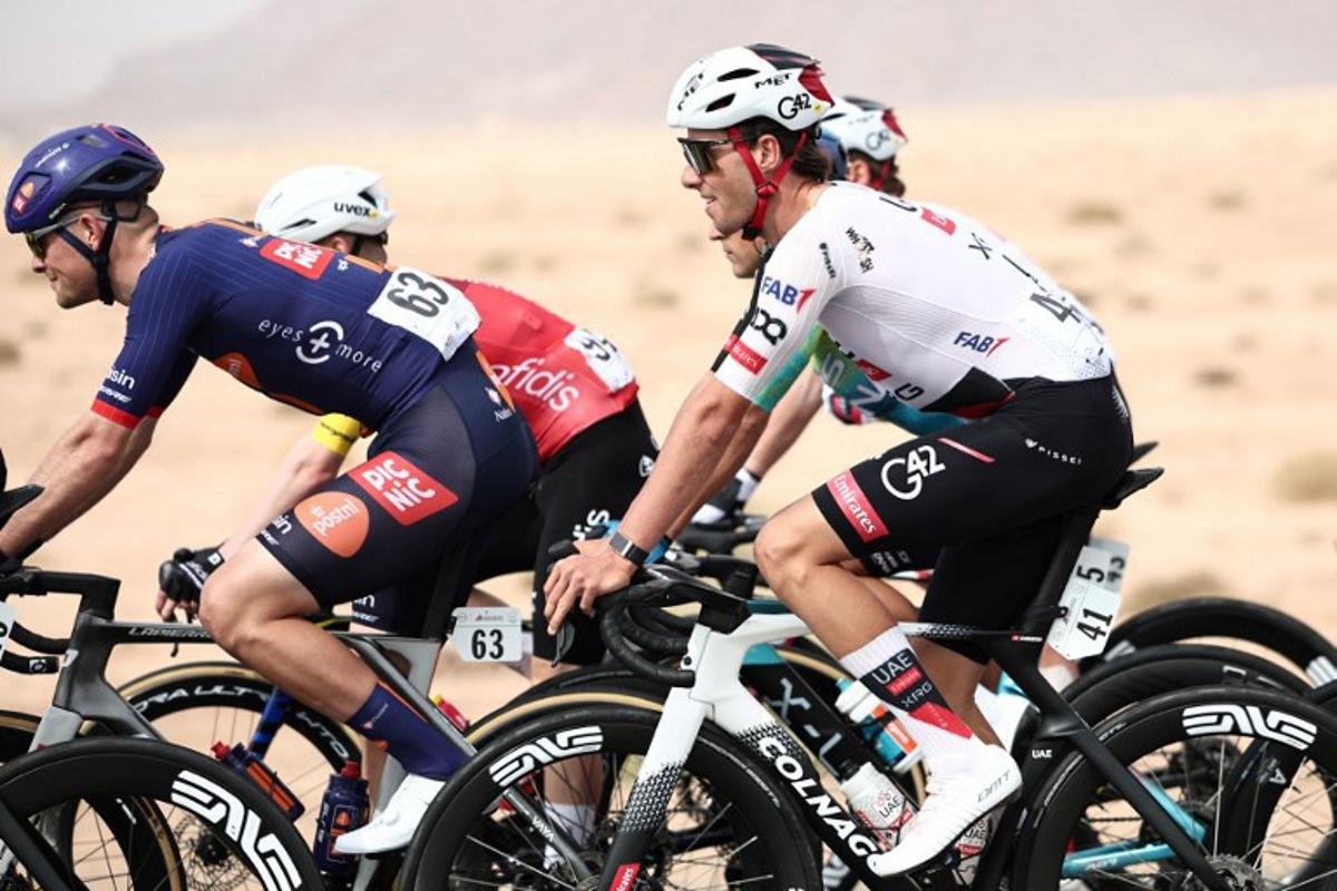 UAE Team Emirates cycling team's Swiss Jan Christen rides during the first stage of the AlUla Tour cycling race, a 158 km race started and finished in the Saudi desert city of AlUla, on January 27, 2026. Anne-Christine POUJOULAT / AFP