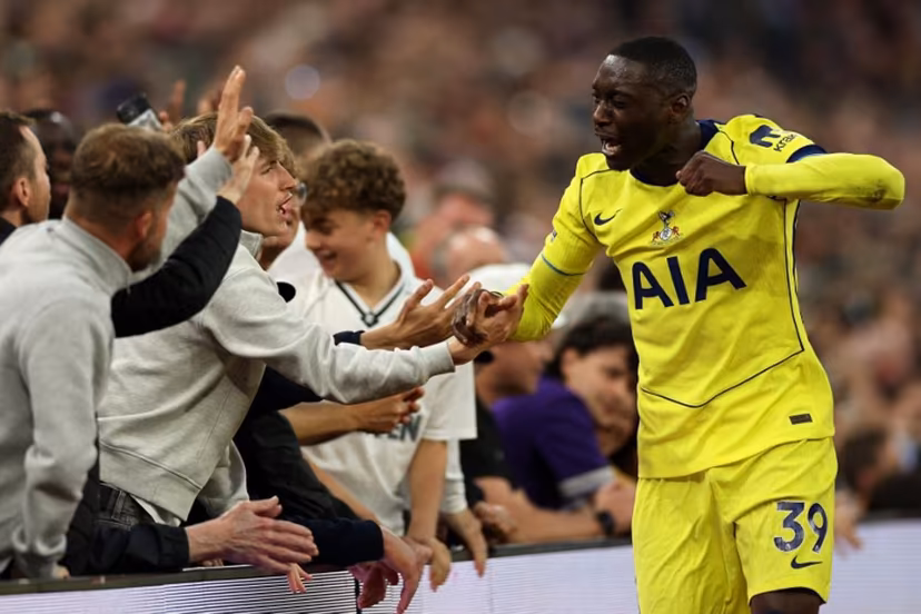 Tottenham Hotspur's French striker #39 Randal Kolo Muani enjoys a moment with supporters after being substituted off during the English Premier League football match between Aston Villa and Tottenham Hotspur at Villa Park in Birmingham, central England on May 3, 2026. Adrian Dennis / AFP