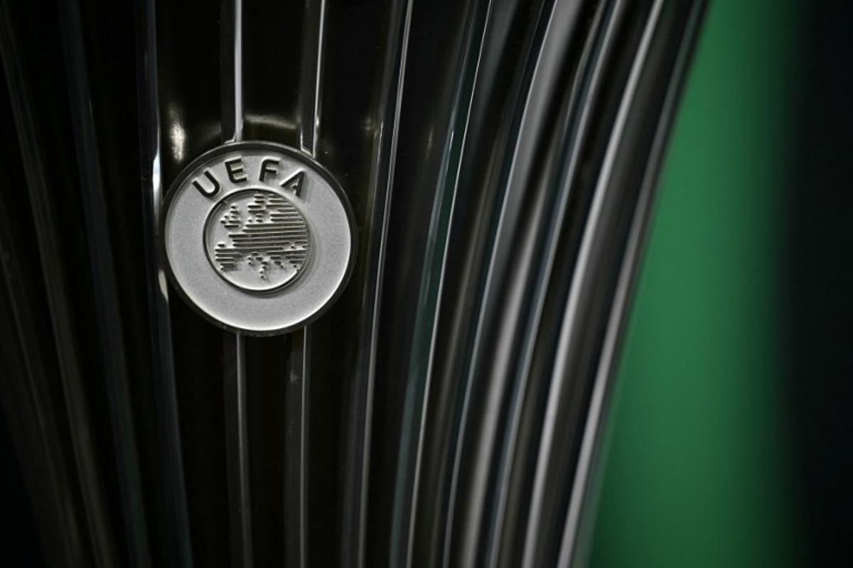 This photograph shows the UEFA logo displayed on the UEFA Conference League Cup ahead of the 2025-2026 UEFA Conference League round of 16, quarter-final and semi-final draw at the House of European Football in Nyon, western Switzerland on February 27, 2026. Harold CUNNINGHAM / AFP