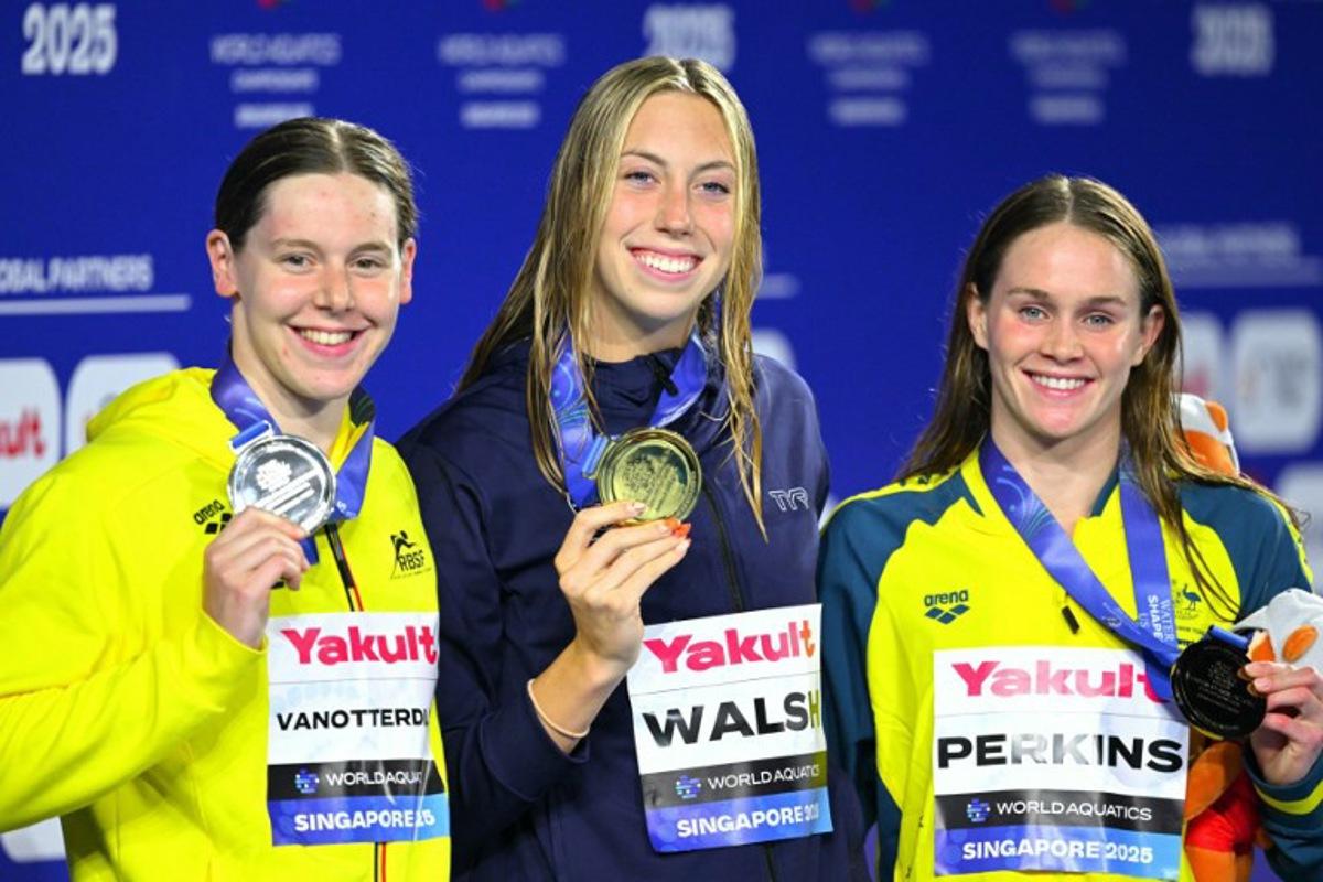 Gold medallist US' swimmer Gretchen Walsh (C), silver medallist Belgium's swimmer Roos Vanotterdijk (L) and bronze medallist Australia's swimmer Alexandria Perkins (R) pose on the podium of the women's 100m butterfly swimming event during the 2025 World Aquatics Championships in Singapore on July 28, 2025. François-Xavier MARIT / AFP