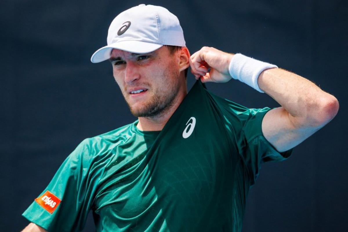 Belgium's Raphael Collignon reacts while playing against USA's Ethan Quinn during their men's singles match at the Brisbane International tennis tournament in Brisbane on January 4, 2026. Patrick HAMILTON / AFP