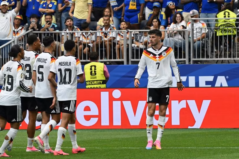 Germany's forward #07 Kai Havertz (R) celebrates with teammates after scoring a penalty kick for his team's third goal during the 2026 World Cup Group E football match between Germany and Curacao at the Houston Stadium in Houston on June 14, 2026. RONALDO SCHEMIDT / AFP