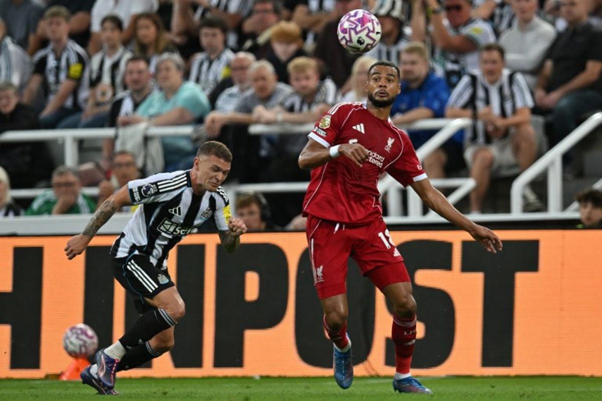 Liverpool's Dutch striker #18 Cody Gakpo (R) controls the ball during the English Premier League football match between Newcastle United and Liverpool at St James' Park in Newcastle-upon-Tyne, north east England on August 25, 2025. ANDY BUCHANAN / AFP