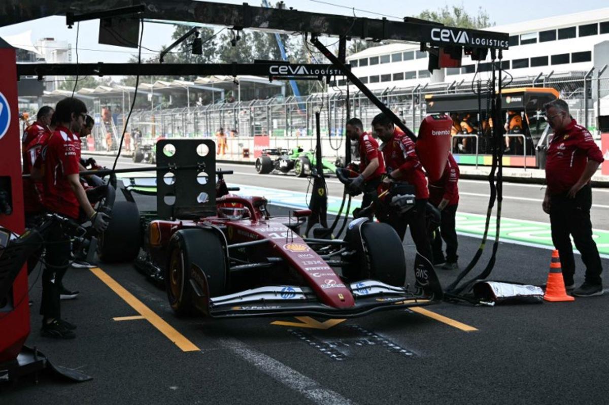 Ferrari's Monegasque driver Charles Leclerc stops in the pits during the first practice session of the Mexico City Formula One Grand Prix at the Hermanos Rodriguez racetrack in Mexico City on October 24, 2025. Carl DE SOUZA / AFP