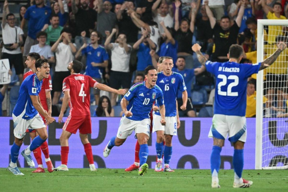 Italy's forward #10 Giacomo Raspadori (C) celebrates scoring his team's first goal during the 2026 World Cup qualifiers Europe zone group I football match between Italy and Moldova at the Mapei Stadium in Reggio Emilia, on June 9, 2025. Alberto PIZZOLI / AFP