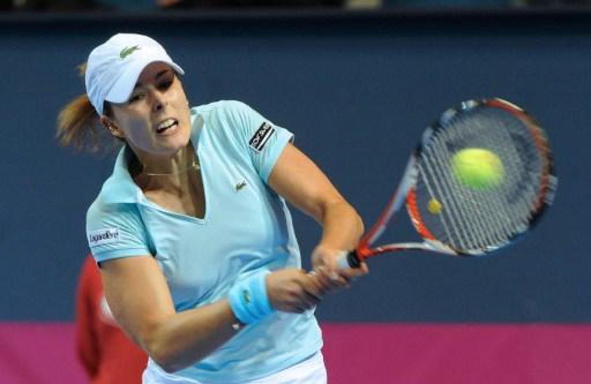 French tennis player Alizée Cornet hits the ball during her match versus Italian Francesca Schiavonne during the first round of the 2009 Fed Cup World group France vs. Italy, on February 7, 2009, in Orleans, central France. AFP PHOTO / ALAIN JOCARD