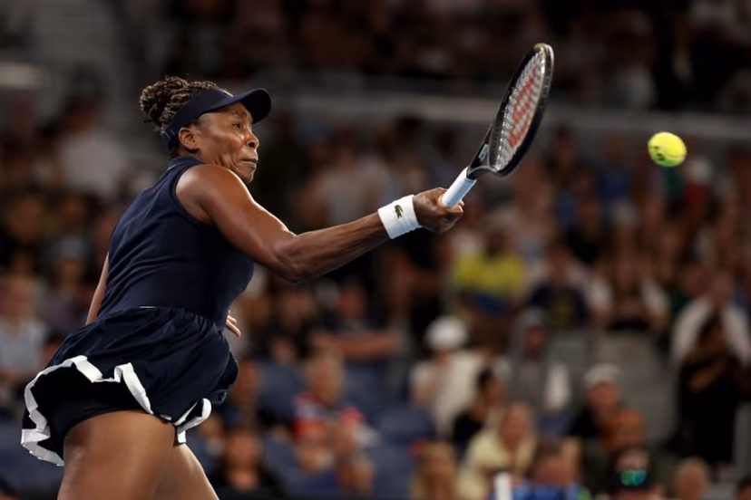 USA's Venus Williams hits a return to Serbia's Olga Danilovic during their women's singles match on day one of the Australian Open tennis tournament in Melbourne on January 18, 2026. Martin KEEP / AFP