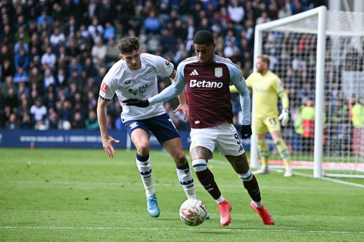 Preston's Irish striker #07 Will Keane (L) fights for the ball with Aston Villa's English striker #09 Marcus Rashford (R) during the English FA Cup quarter-final football match between Preston North End and Aston Villa at Deepdale stadium in Preston, north-west England on March 30, 2025. Paul ELLIS / AFP
