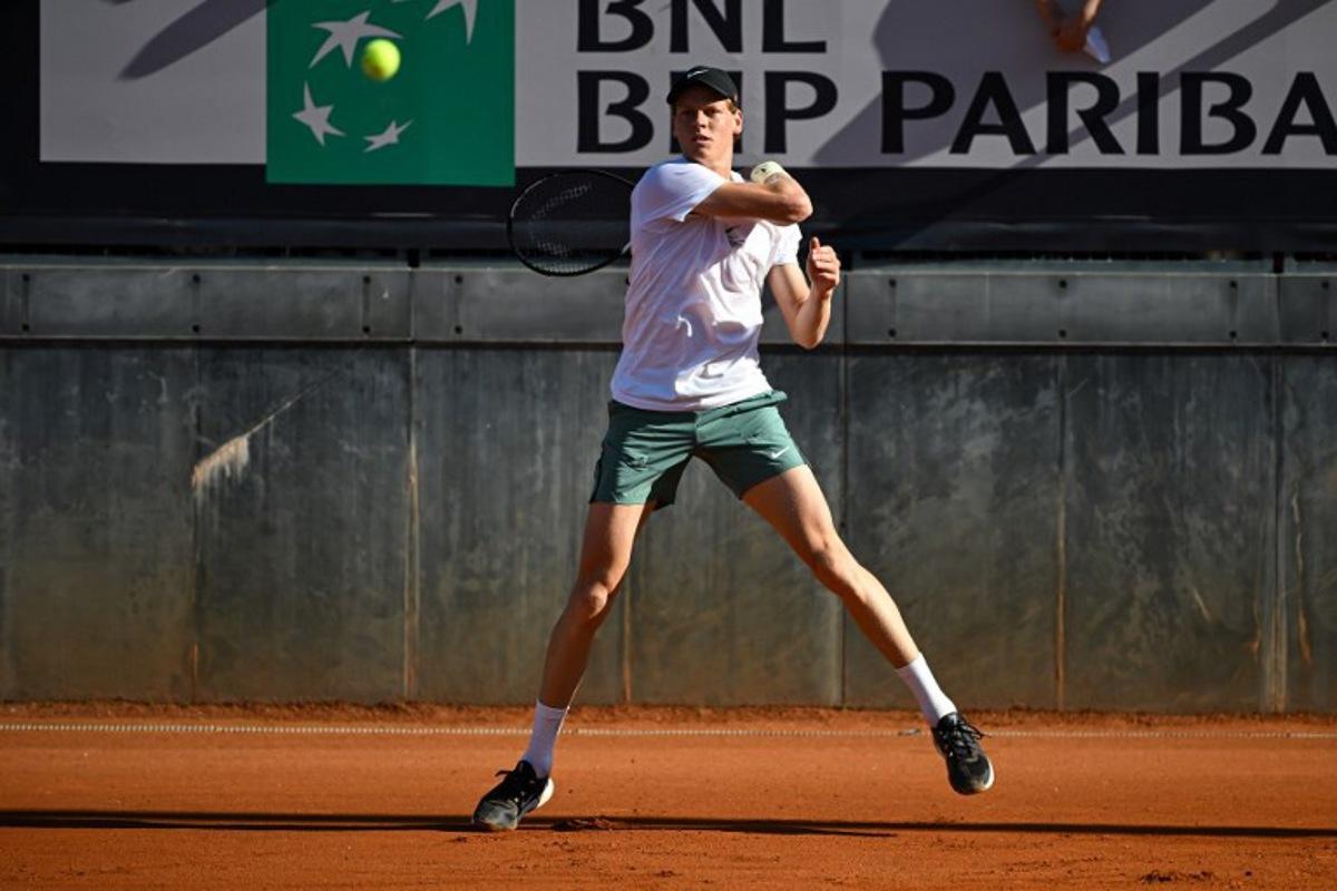Italy's Jannik Sinner returns the ball to US Taylor Fritz during a training session ahead of the ATP Rome Open tennis tournament at Foro Italico in Rome, on May 7, 2025. PIERO CRUCIATTI / AFP