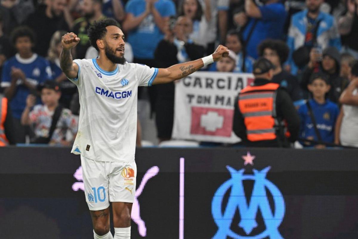 Marseille's French-Gabonese forward #10 Pierre-Emerick Aubameyang celebrates after scoring his team's first goal during the French L1 football match between Olympique Marseille (OM) and FC Lorient at the Stade Velodrome in Marseille, southern France, on May 12, 2024. Nicolas TUCAT / AFP