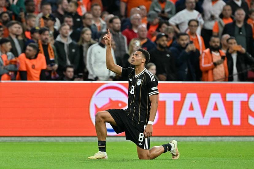 Germany's midfielder #08 Felix Nmecha celebrates after scoring his team's first goal during the UEFA Nations League (League A, Group A2) football match between Netherlands and Germany at Johan Cruijff ArenA in Amsterdam on September 24, 2026. NICOLAS TUCAT / AFP