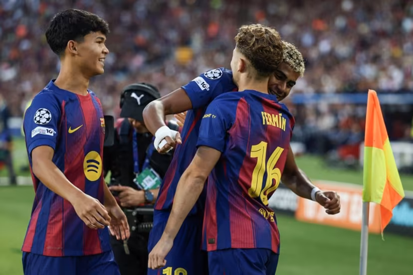 Barcelona's Spanish midfielder #16 Fermin Lopez (R) celebrates scoring their first goal with Barcelona's Spanish forward #10 Lamine Yamal and Barcelona's Spanish midfielder #27 Pedro Fernandez "Dro" (L) during the UEFA Champions League league phase match-day 3 football match between FC Barcelona and Olympiakos FC at Estadi Olimpic Lluis Companys in Barcelona on October 21, 2025. Josep LAGO / AFP