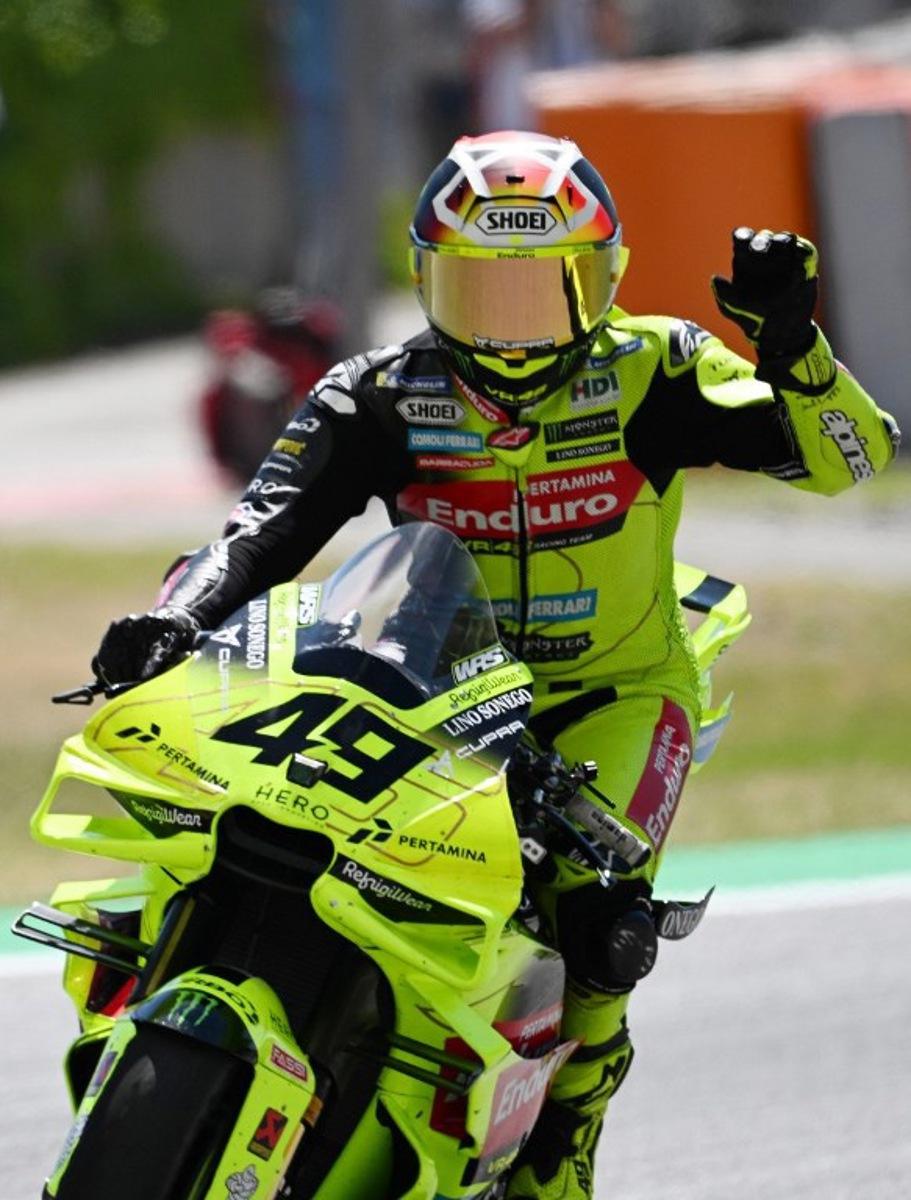 Team Pertamina Enduro VR46 Racing Team's Fabio Di Giannantonio celebrates his thirs place after the Sprint Race at the Catalunya Moto GP Grand Prix at the Catalunya racetrack in Montmelo, near Barcelona, on May 16, 2026. Jose Jordan / AFP