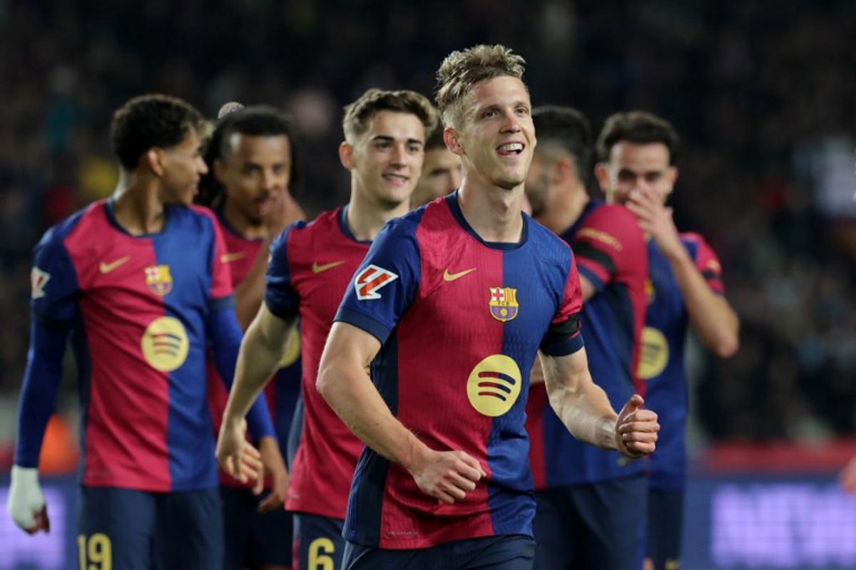 Barcelona's Spanish forward #20 Daniel Olmo celebrates after scoring a penalty kick and his team's second goal during the Spanish league football match between FC Barcelona and CA Osasuna at Estadi Olimpic Lluis Companys in Barcelona on March 27, 2025. LLUIS GENE / AFP