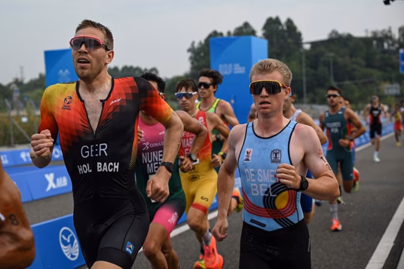 Germany's Fabian Holbach (L) and Belgium's Thibaut De Smet (R) compete in the men's individual duathlon final during the 2025 World Games at the Xinglong Lake Hubin Arena in Chengdu, in China's southwestern Sichuan province on August 14, 2025. Jade GAO / AFP