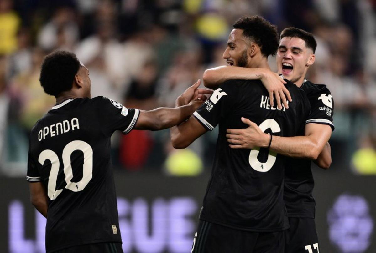 Juventus' English defender #06 Lloyd Kelly (C), Juventus' Turkish forward #10 Kenan Yildiz and Juventus' Belgian defender #20 Ikoma-Lois Openda celebrates at the end of the UEFA Champions League first round day 1 football match between Juventus and Borussia Dortmund at the Allianz stadium in Turin, northern Italy, on September 16, 2025. Marco BERTORELLO / AFP