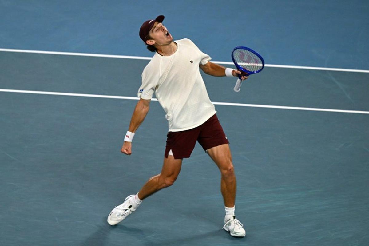 Australia's Alex De Minaur celebrates beating Kazakhstan's Alexander Bublik in their men's singles match on day eight of the Australian Open tennis tournament in Melbourne on January 25, 2026. WILLIAM WEST / AFP