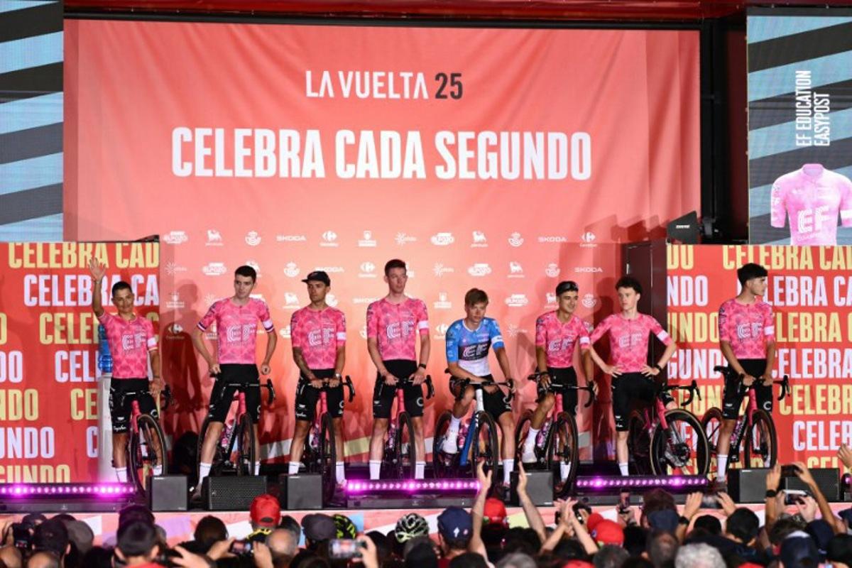 Team EF Education - Easypost riders stand on stage during the official teams presentation of the 80th edition of 'La Vuelta' cycling tour of Spain, in Torino, Italy on August 21, 2025. Marco BERTORELLO / AFP