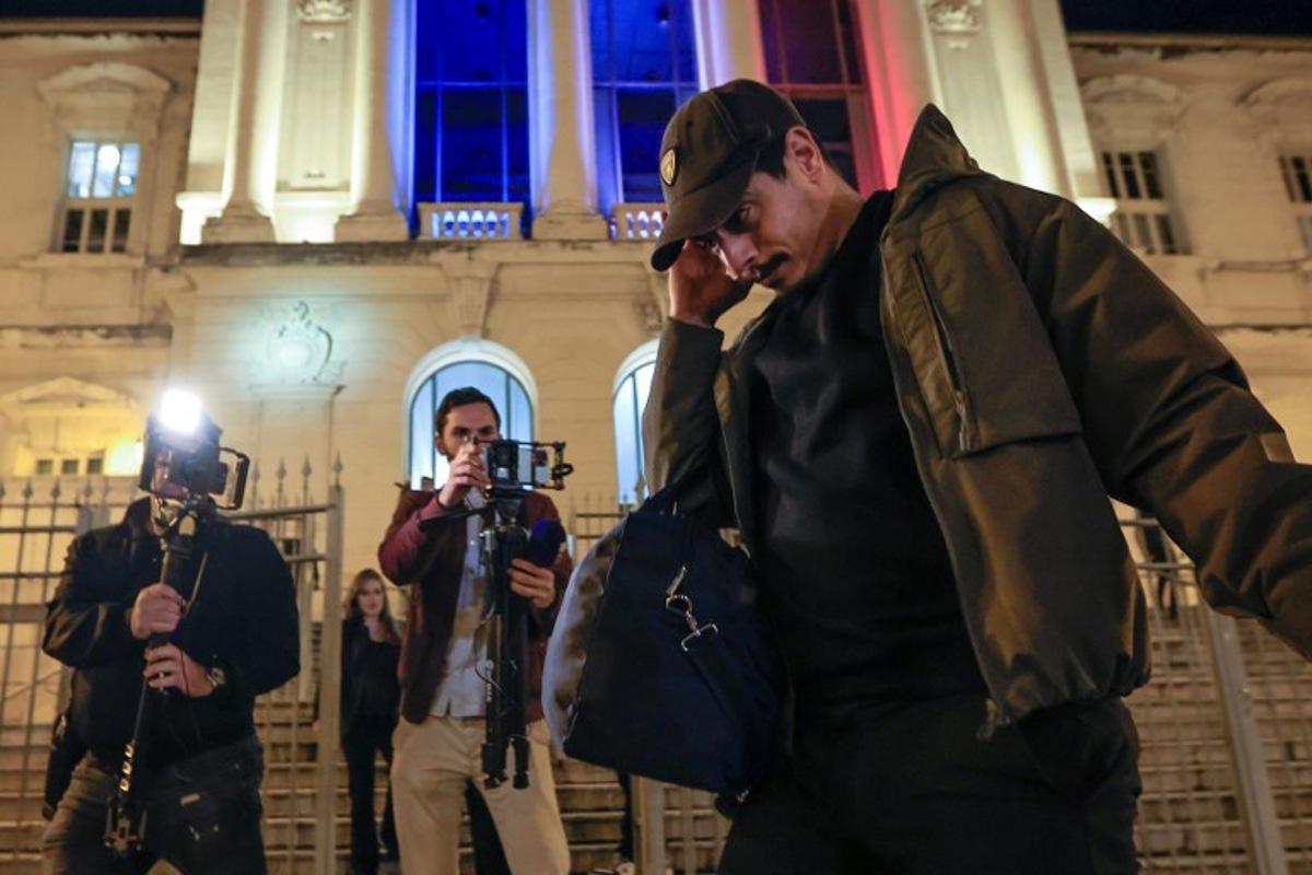 Former French L1 football player Wissam Ben Yedder (R) leaves the courthouse of Nice after his trial charged with sexually assaulting a woman in September, in Nice, southeastern France, on October 15, 2024. The French football player Wissam Ben Yedder has been under strict police control awaiting trial but not in detention. The charges against him carry a maximum penalty of 10 years in jail. Valery HACHE / AFP