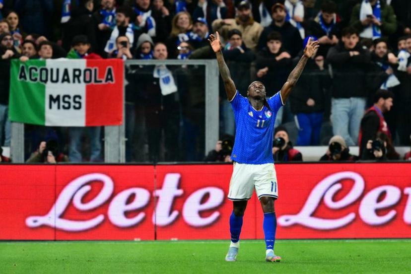 Italy's forward #11 Moise Kean celebrates after scoring his team's second goal during the play-off FIFA World Cup 2026 European qualification semi-final football match between Italy and North Ireland at the Gewiss stadium in Bergamo, on March 26, 2026. Stefano RELLANDINI / AFP