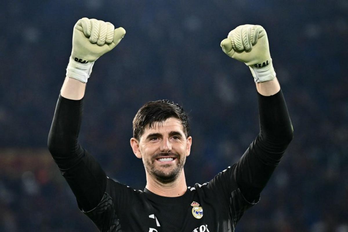 Real Madrid's Belgian goalkeeper #01 Thibaut Courtois celebrates with supporters after winning the UEFA Champions League - 1st round day 2 football match between AS Roma and Real Madrid at the Olympic Stadium in Rome on October 14, 2026. Filippo MONTEFORTE / AFP