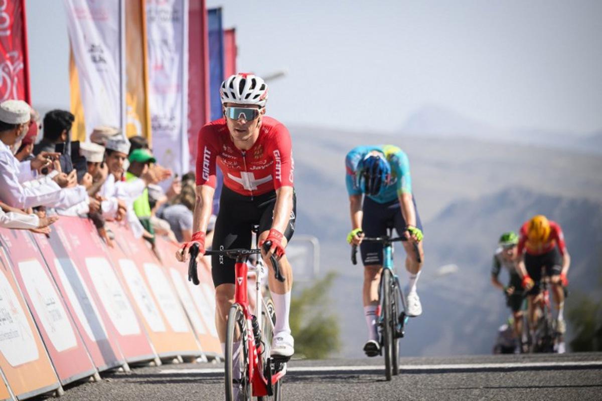 Team Jayco AlUla Swiss rider Mauro Schmid crosses the finish line to win the 3d stage of the Tour of Oman cycling race from Samail "Al Fayhaa Resthouse" to Misfat Al Abriyeen, on February 9, 2026. Loic VENANCE / AFP