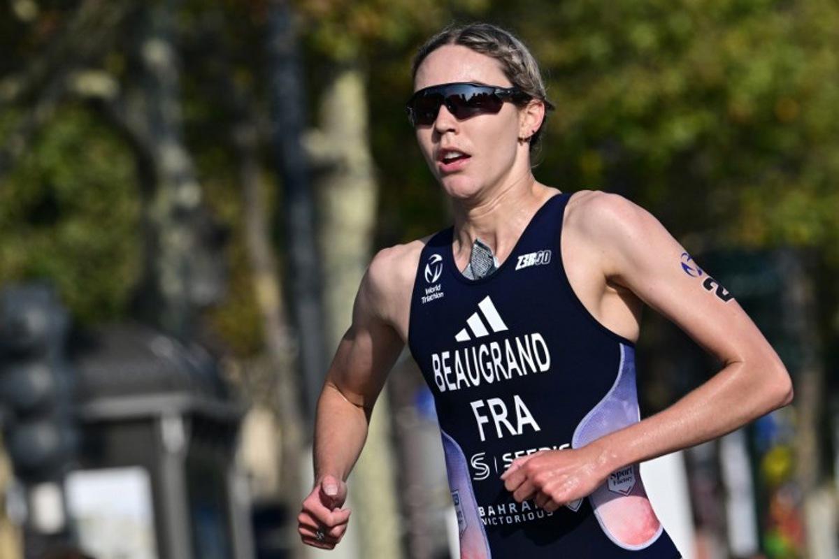 France's Cassandre Beaugrand runs during a Test Event for the women's triathlon for the upcoming 2024 Olympic Games in Paris, on August 17, 2023. From August 17 to 20, 2023, Paris 2024 is organising four triathlon events to test several arrangements, such as the sports operations, one year before the Paris 2024 Olympic and Paralympic Games. Miguel MEDINA / AFP