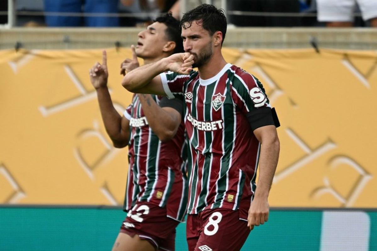 Fluminense's Brazilian midfielder #08 Martinelli celebrates scoring his team's first goal next to Fluminense's Colombian defender #12 Gabriel Fuentesduring the FIFA Club World Cup 2025 quarterfinal football match between Brazil's Fluminense and Saudi Arabia's Al-Hilal at the Camping World Stadium in Orlando on July 4, 2025. CHANDAN KHANNA / AFP