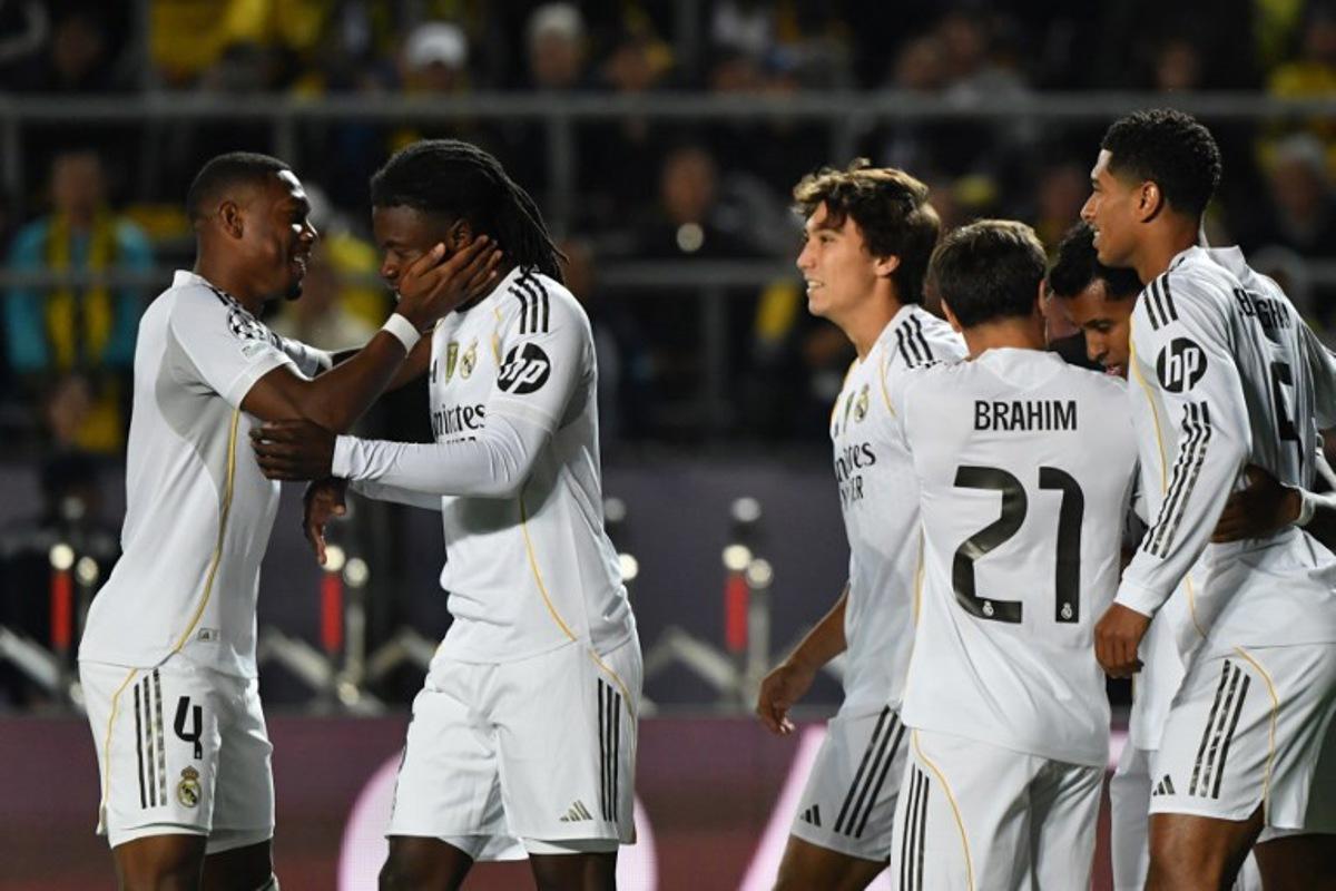 Real Madrid's French midfielder #06 Eduardo Camavinga (2nd L) celebrates scoring his team's fourth goal with his teammates during the UEFA Champions League first round day 2 football match between Kairat Almaty and Real Madrid at the Almaty Ortalyk stadion in Almaty on September 30, 2025. Vyacheslav OSELEDKO / AFP